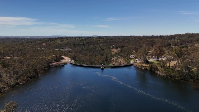 Barossa Reservoir Reserve, Williamstown, South Australia &ndash; 4K aerial drone footage of Whispering Wall dam, blue reservoir lake and surrounding forest landscape