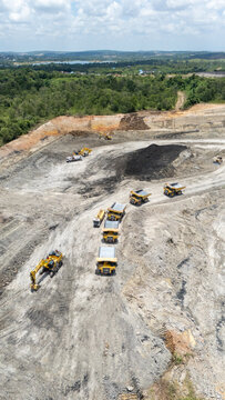Drone footage from a coal mining site in South Kalimantan shows trucks and heavy equipment in action