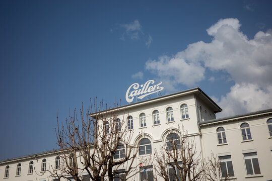 BROC, SWITZERLAND &ndash; MARCH 8, 2026: Exterior view of the historic Cailler chocolate factory building with the Cailler brand rooftop sign above the facade in Broc, Fribourg canton, Switzerland