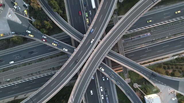 Top Down Zoom out Aerial View of Highway Interchange with Traffic and Overpass Bridges