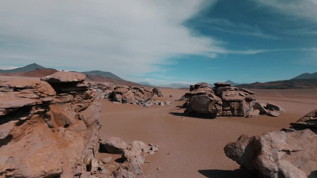 Aerial view of eroded rock formations in the Siloli Desert of Bolivia. Volcanic landscapes and vast desert plains create a dramatic Andean scenery.