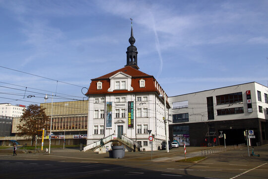 Gera, Germany - March 8, 2026: Stadtmuseum Gera, a historic building with baroque architecture and red mansard roof, exterior staircase and statue of a lion in front