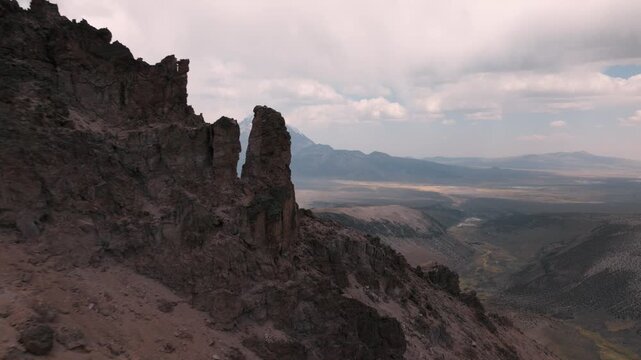 Aerial view of volcanic peaks, alpine lakes and rugged terrain in Sajama National Park, Bolivia. A remote high-altitude landscape in the Andes.