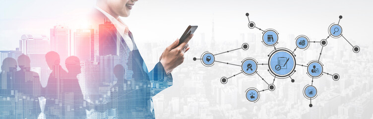 A business professional interacts with a smartphone, illustrating digital network connections...