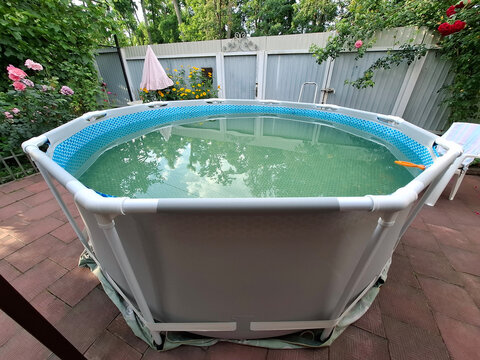 Blue outdoor man-made open-air swimming frame pool