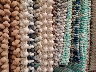 Soft bathroom floor mats are sold in a store