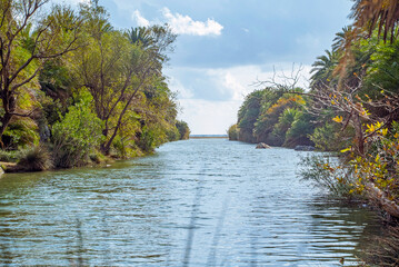 Preveli Beach, Crete, Greece: River flowing through lush green vegetation towards the sea © Elsworth Frobisher