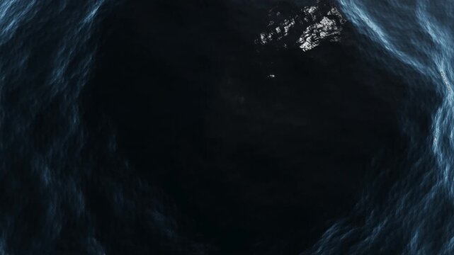 Abstract Dark Blue Water Vortex or Cave Entrance with Reflective Surface and Ripples