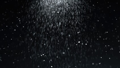 Obraz premium A cascade of white particles descending against a dark background, abstract and ethereal