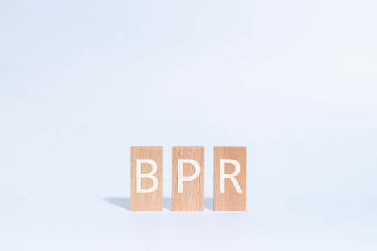 Eye-catching image of BPR text on wood blocks. The word stands for Business Process Re-engineering.