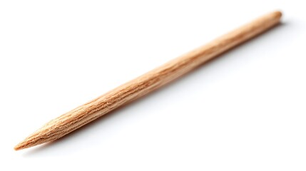Naklejka premium A Single Wooden Toothpick with a Pointed End on a White Background.