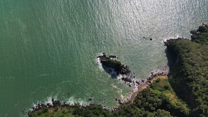 Aerial drone view of Karang Agung beach, Kebumen, Central Java, Indonesia, coastline with hills,...