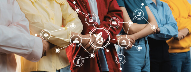 A diverse group of professionals stands shoulder to shoulder, showcasing a modern business environment with digital connectivity and collaboration concepts represented visually. Amity © InfiniteFlow