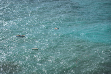 Fototapeta premium San Lazzaro, Amalfi Coast, Italy: Three boats on choppy turquoise ocean water