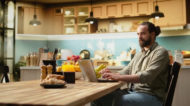 Confused preoccupied male, uncertain with remote work, laptop working from home, unsure male freelancer frowning at the screen and struggling to solve ambiguous teleworking, man in doubt.