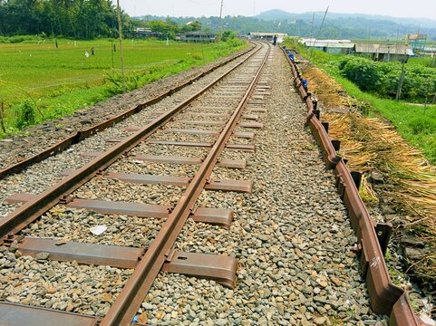 ANTIQUE TRAIN RAILS ALONG RAWA PENING LAKE IN THE AMBARAWA OLD TRAIN STATION AREA