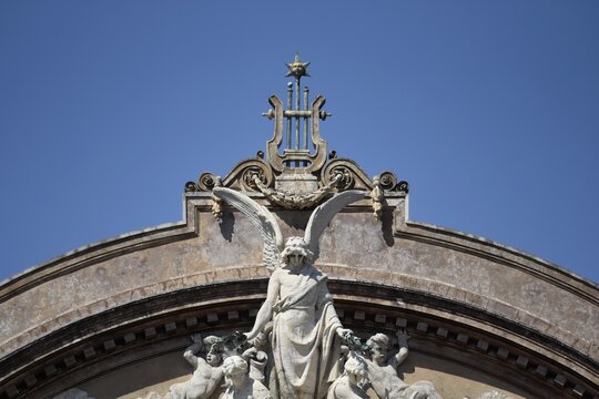 Scenic upper part facade view of the historic landmark and Opera house Teatro Massimo Vincenzo Bellini on Via Giuseppe Perrotta in Catania Sicily.