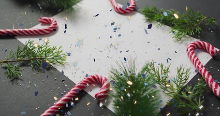 Vertical video: Lighting white sheet, light casting on dark table for holiday card with candy canes © vectorfusionart
