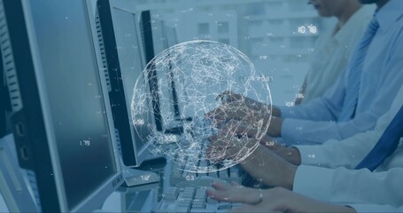 Typing ops team in business attire analyzing data at desks with screens, keys and digital globe