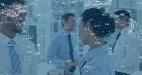 Discussing five-person team in office wearing business attire with coffee cup, badge, data overlay