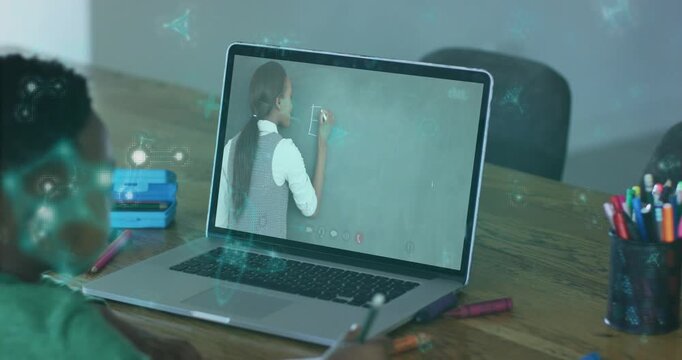 Teacher writing on board causing teal UI, child copying paper by pencil using laptop for learning
