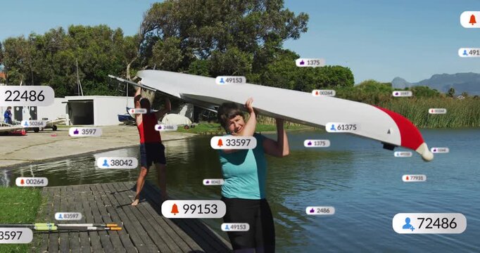 Vertical video: Bracing woman starting lift, blue and red tops launching shell from dock, badges