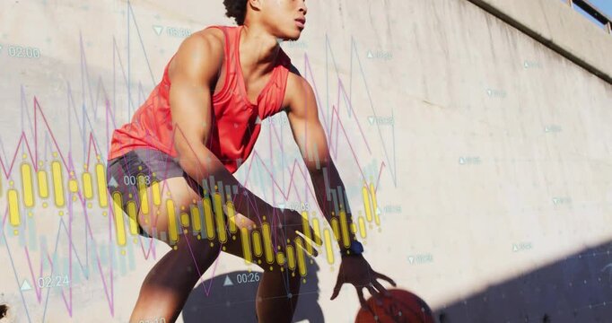 Male basketball player dribbling low on sunlit wall, camera pullback revealing charts for training