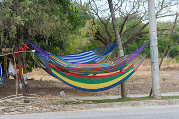 Brightly Colored Woven Cotton Hammocks Displayed Outdoor Ready for Purchase