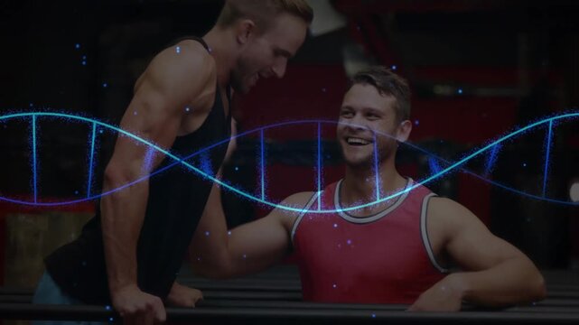 Spotter supporting lifter legs, checking form, lifter holding L-sit, partners cheering under helix