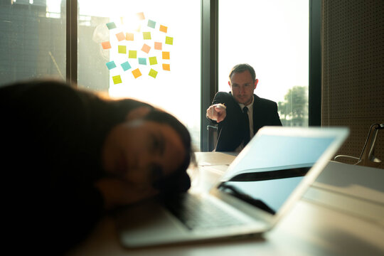 Business manager with emotional tension during a tense office meeting