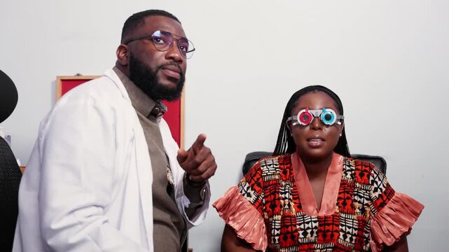 African optometrist performing an eye examination on a female patient in a clinic using trial frames