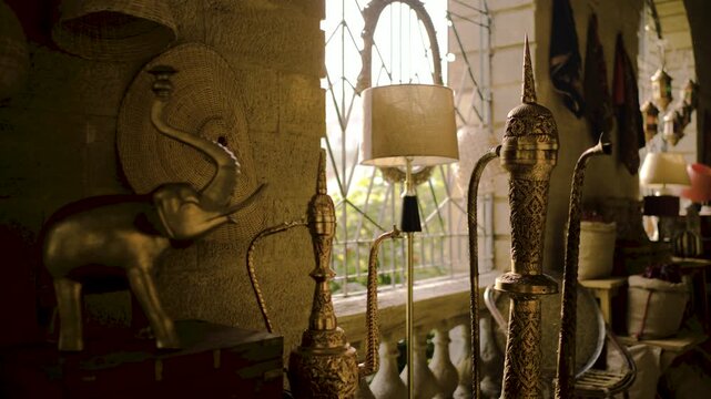 Of a Karachi antique shop bazar showcasing vintage decor and cultural heritage Brass hookahs