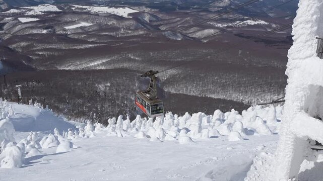 Hakkoda Ropeway Cable Car going up a snowy mountain in Aomori Japan