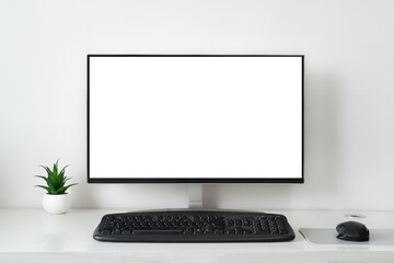 Fototapeta premium Computer Monitor Blank Display Screen with Flower Pot,keyboard, workplace desktop