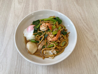 A signature dish of Phuket, Hokkien Fried Noodles is a savory local favorite known for its rich flavors and authentic island heritage