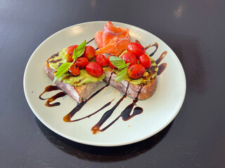 Avocado and Tomato with smoked salmon on Sourdough, The ultimate healthy meal for perfect all-day brunch