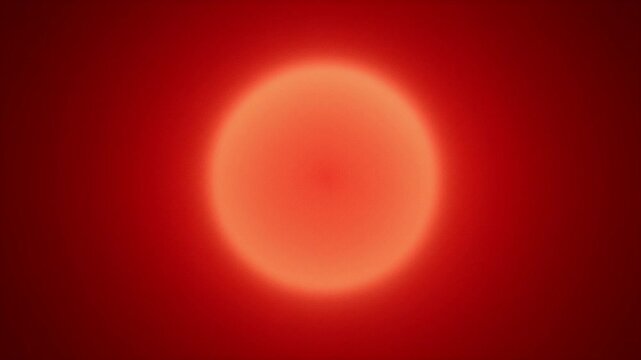 Abstract red orb surrounded by an intense red hue, suggesting heat