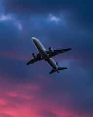 ascending during sunset, aircraft under dramatic sky, aviation travel, skydiving perspective, sky background, twilight flight.