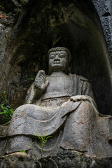 Obraz premium Hangzhou, China, Buddha sculpted inside a rock, fei lai feng