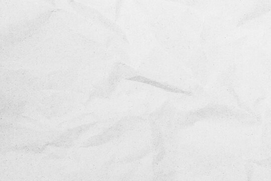 White recycled craft paper texture as background. Grey paper texture, Old vintage page or grunge vignette of old newspaper. Pattern rough art creased grunge letter. Hardboard with copy space for text.