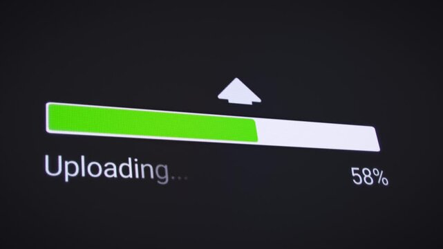 Video animation of the process of uploading file from the Internet on a computer monitor screen. A computer monitor displaying information about the data download in real time.