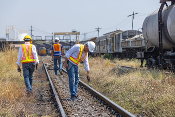 Railway Engineers Conducting Track Inspection at Rail Yard