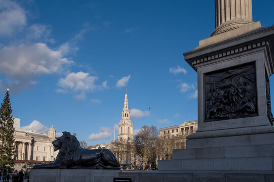 London, United Kingdom &ndash; View of Nelson&rsquo;s Column relief panels and bronze lion in Trafalgar Square, the monument commemorating Admiral Nelson&rsquo;s 1805 victory with detailed Victorian sculpture.