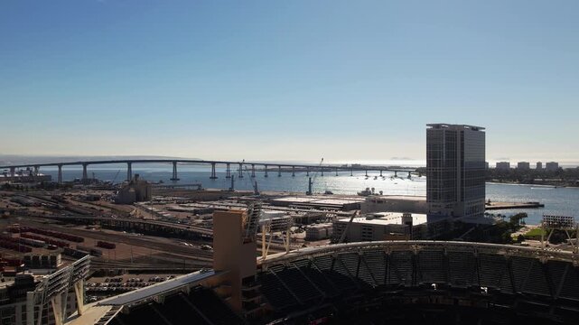 Aerial drone view of downtown San Diego, California featuring Petco Park stadium and the San Diego&ndash;Coronado Bridge. Urban skyline and waterfront cityscape of San Diego with modern buildings and harbor