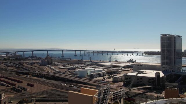 Aerial drone view of downtown San Diego, California featuring Petco Park stadium and the San Diego&ndash;Coronado Bridge. Urban skyline and waterfront cityscape of San Diego with modern buildings and harbor