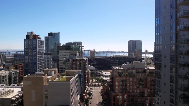Aerial drone view of downtown San Diego, California featuring Petco Park stadium and the San Diego&ndash;Coronado Bridge. Urban skyline and waterfront cityscape of San Diego with modern buildings and harbor