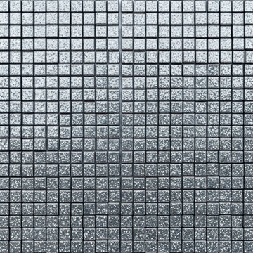 Flawless geometric pattern of thousands of small, square, silver-blue iridescent metallic rhinestones displaying distressed glitter texture, captured in extreme macro, high-key environment. Concept