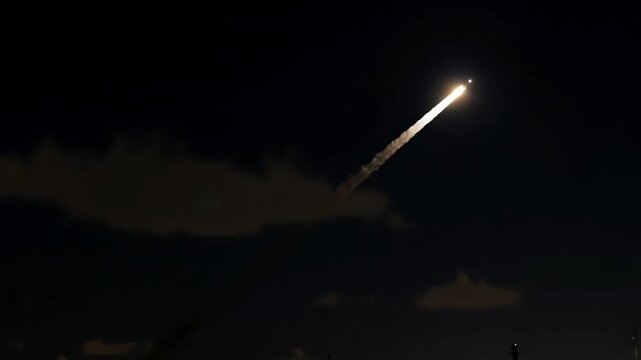 Rocket Launches Into Night Sky.
