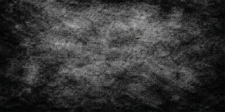 A dark vintage grunge background featuring a textured black and grey concrete wall surface with an aged stone pattern for a rough dirty backdrop design