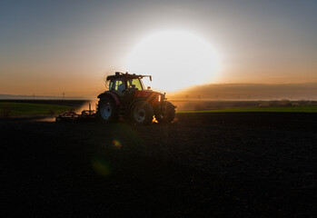 Fototapeta premium Tractor preparing the land for a new crop planting